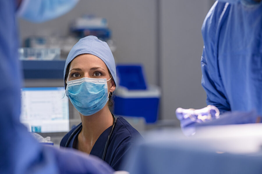Anesthesiology team member in the operating room supporting patient care during surgery.